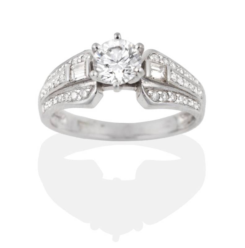 Lot 2040 - A 14 Carat White Gold Diamond Ring, a round brilliant cut diamond in a claw setting, to...