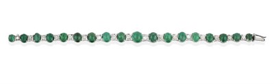 Lot 2042 - An Emerald and Diamond Bracelet, graduated oval cabochon emeralds spaced by single-cut diamond...