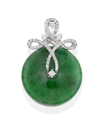 Lot 2049 - A Jade and Diamond Pendant, a jade bi mounted by a diamond set scroll bail, stated diamond...