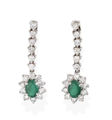 Lot 2050 - A Pair of Emerald and Diamond Pendant Earrings, an articulated line of round brilliant cut diamonds