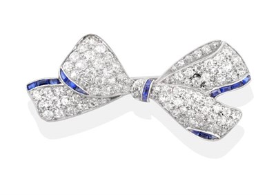 Lot 2072 - An Art Deco Sapphire and Diamond Bow Brooch, pavé set with old cut diamonds and calibré cut...