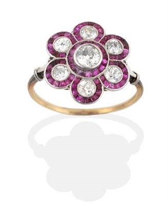 Lot 2073 - An Early Twentieth Century Ruby and Diamond Cluster Ring, a central old cut diamond within a flower