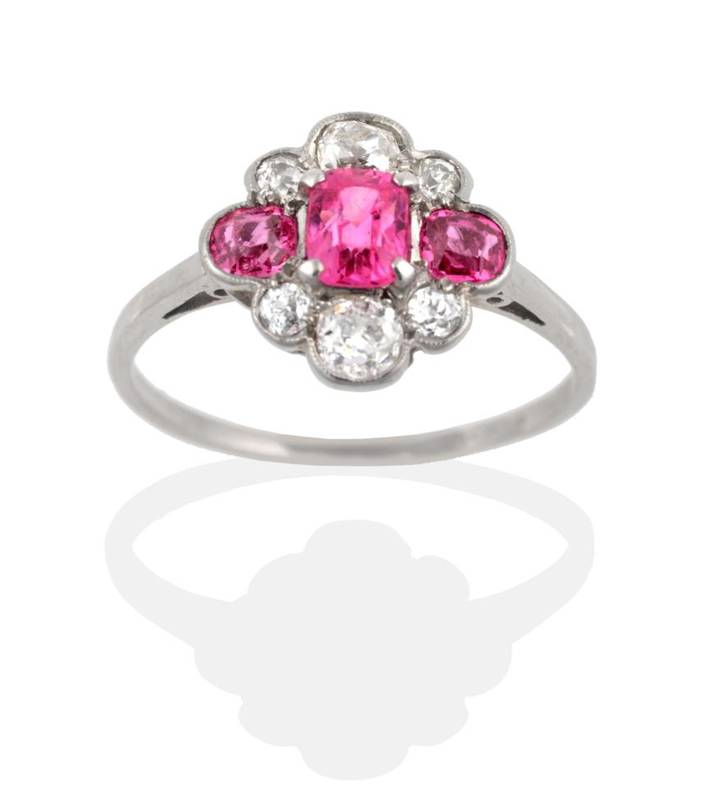 Lot 2078 - An Early Twentieth Century Pink Sapphire and Diamond Cluster Ring, an octagonal cut pink...