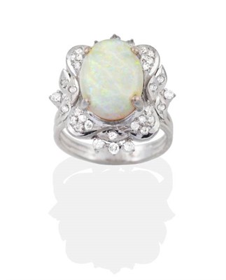 Lot 2080 - An Opal and Diamond Cluster Ring, an oval opal within a shaped frame of single cut diamonds, to...