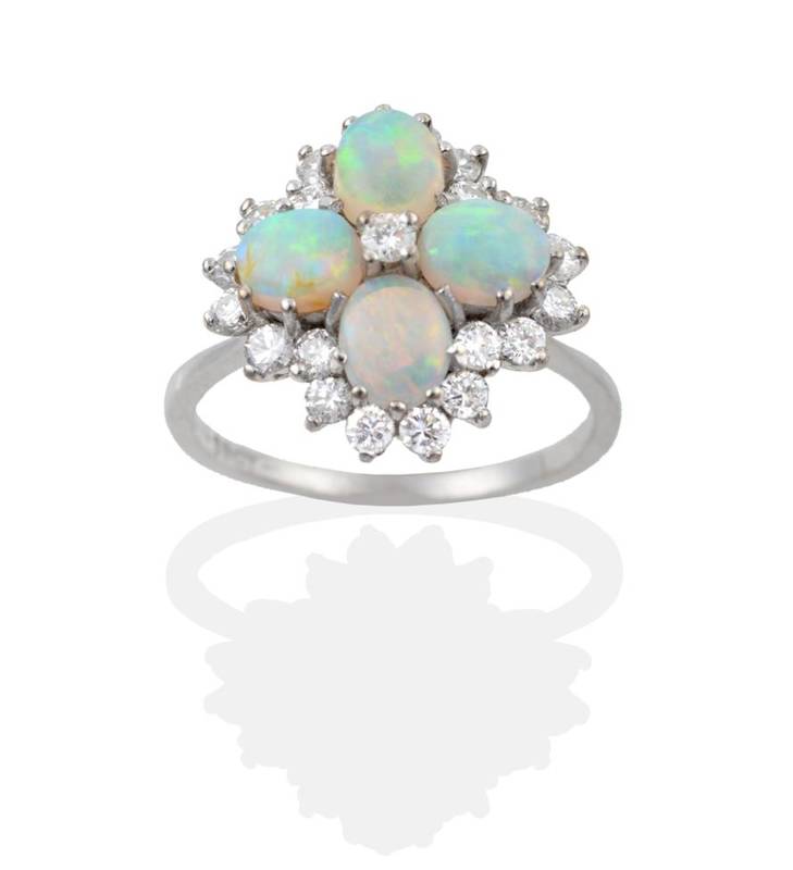 Lot 2084 - An Opal and Diamond Cluster Ring, four oval cut opals with a central round brilliant cut...