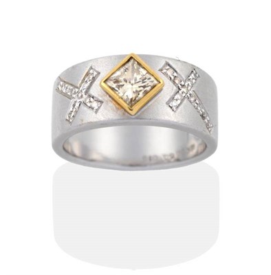 Lot 2085 - A Coloured Princess Cut Diamond Ring, a pale yellow princess cut diamond in a rubbed over...
