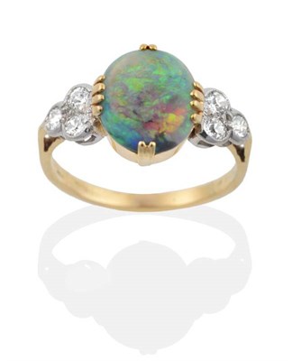 Lot 2089 - An 18 Carat Gold Early Twentieth Century Black Opal and Diamond Ring, an oval black opal in a fancy