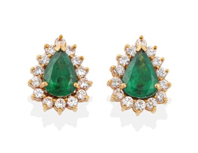 Lot 2115 - A Pair of Emerald and Diamond Cluster Earrings, pear cut emeralds within borders of round brilliant