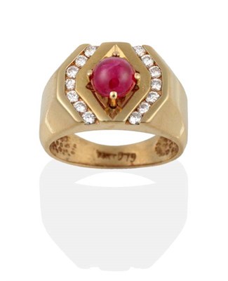 Lot 2123 - A Ruby and Diamond Ring, a round cabochon ruby spaced by channel set band of round brilliant...