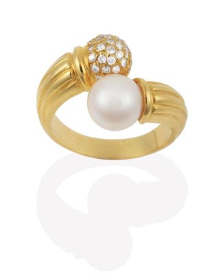 Lot 2129 - A Cultured Pearl and Diamond Torque Crossover Ring, a cultured pearl and a pavé set diamond...