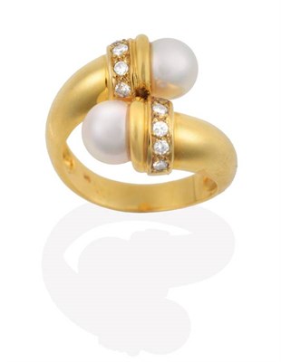 Lot 2130 - A Cultured Pearl and Diamond Torque Crossover Ring, two cultured pearls above round brilliant...