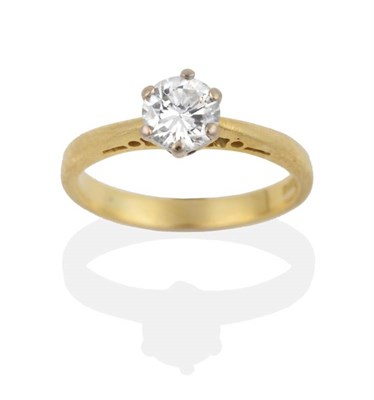 Lot 2135 - An 18 Carat Gold Solitaire Diamond Ring, a round brilliant cut diamond in a claw setting, to...