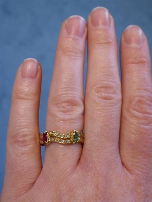 Lot 2141 - An Emerald, Ruby, Sapphire and Diamond Eternity Ring, marquise cut emeralds, rubies and...