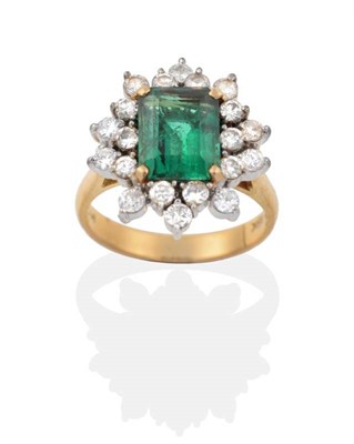 Lot 2149 - An Emerald and Diamond Cluster Ring, an octagonal cut emerald within a two tier border of round...