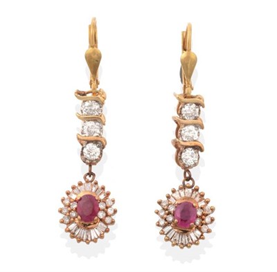 Lot 2168 - A Pair of Ruby and Diamond Pendant Earrings, an articulated band of round brilliant cut...