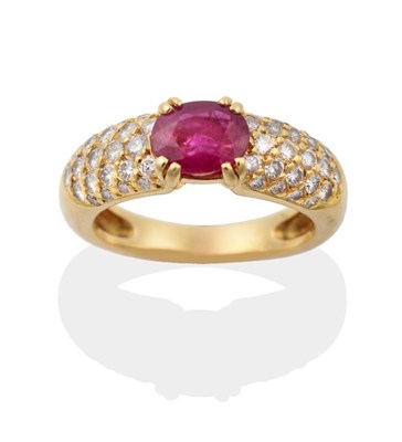 Lot 2169 - A Ruby and Diamond Ring, an oval cut ruby in a double claw setting, to pavé set diamond shoulders
