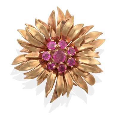Lot 2172 - A Ruby Floral Brooch, a cluster of round cut rubies within a petal surround, measures 3.5cm in...