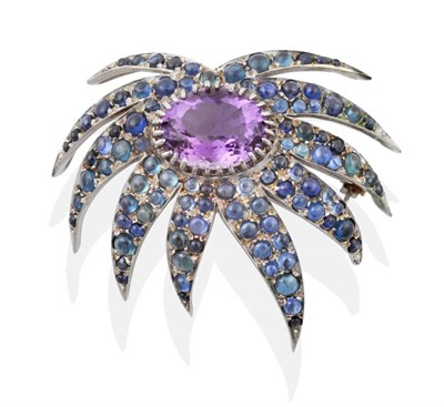 Lot 2181 - An Amethyst and Sapphire Spray Brooch, an oval cut amethyst in a claw setting within a border...