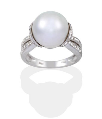 Lot 2185 - A Cultured Pearl and Diamond Ring, a cultured pearl within a cup setting, grain set with round...