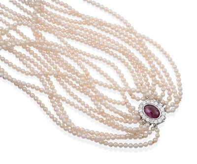 Lot 2187 - A Multi-Strand Cultured Pearl Necklace, with a Ruby and Diamond Clasp, ten strands of uniform...