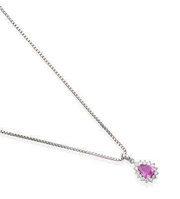 Lot 2189 - An 18 Carat White Gold Pink Sapphire and Diamond Cluster Pendant, a pear cut pink sapphire within a