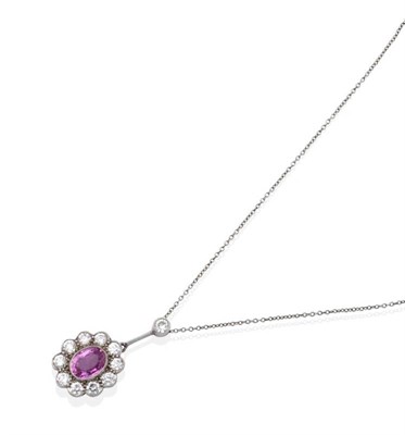 Lot 2191 - A Pink Sapphire and Diamond Cluster Pendant, on Chain, a grain set round brilliant cut diamond...