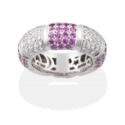 Lot 2196 - A Pink Sapphire and Diamond Hoop Ring, bands of alternating pavé  set round cut pink sapphires and