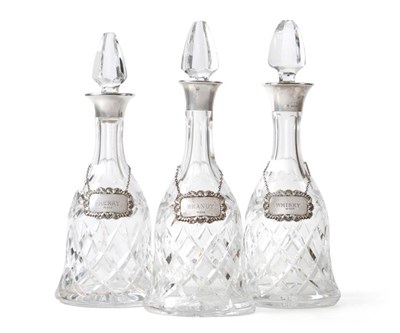 Lot 2272 - A Matched Set of Three Silver Mounted Cut Glass Decanters and Labels, C S Green & CO,...