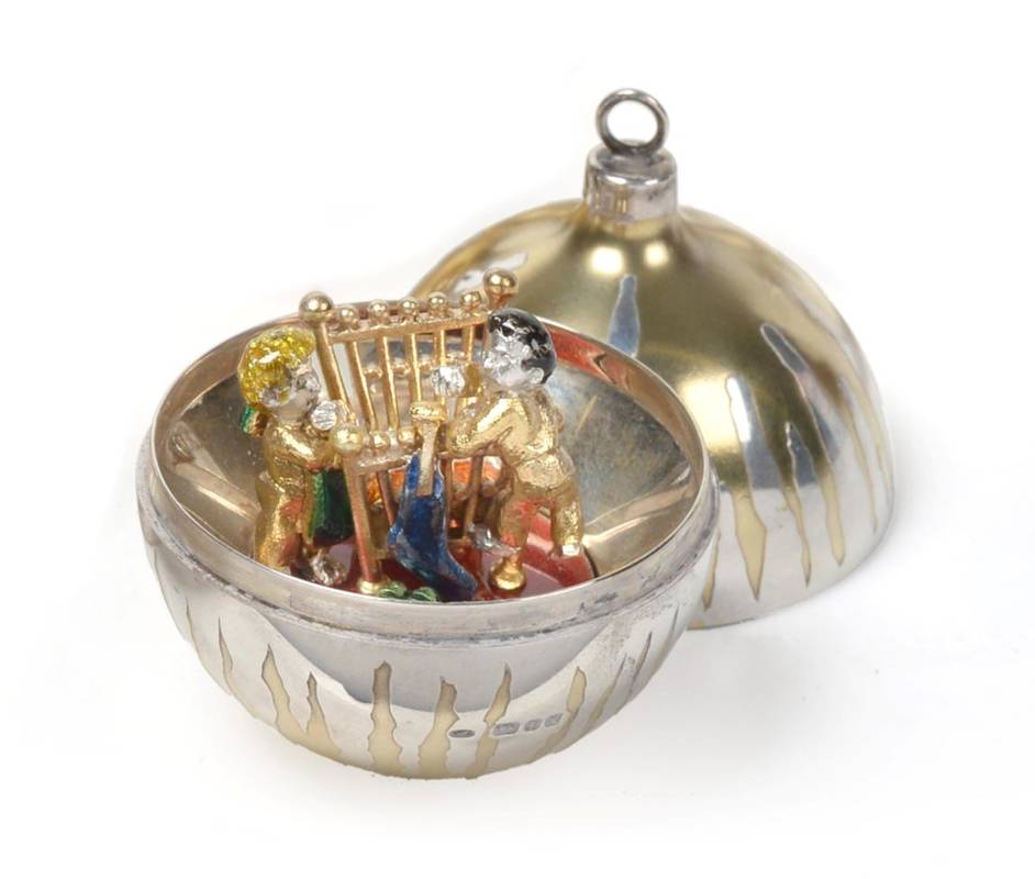 Lot 2429 - Stuart Devlin: A Parcel Gilt Silver Surprise Christmas Bauble, London 1982, the interior...