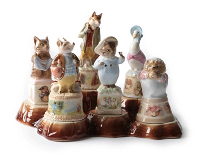 Lot 183 - Royal Worcester, Beatrix Potter Set of six Golden Edition Candle Snuffers, Celebrating Peter Rabbit