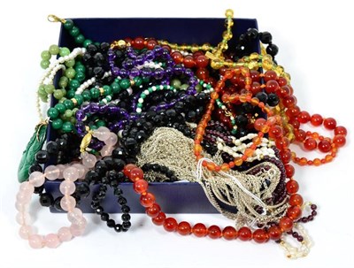 Lot 10 - Hardstone bead necklaces, including a triple strand garnet bead and freshwater pearl necklace,...