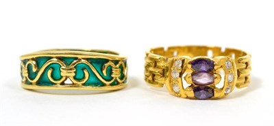 Lot 19 - A green plique a jour enamel ring, finger size O, stamped '18K', 5.5g and an amethyst and white...