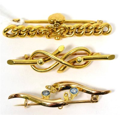 Lot 24 - A chain brooch with heart pendant, a gem-set brooch and a scroll brooch, all stamped '15CT',...