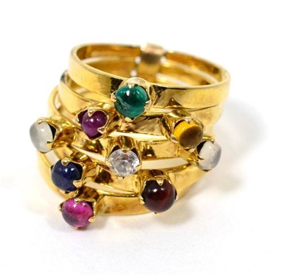 Lot 25 - A multi-gemstone stacking ring, of five bands each set with a cabochon, including emerald, citrine