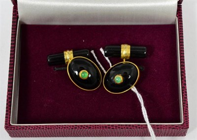 Lot 31 - A pair of onyx and emerald gilt metal cufflinks