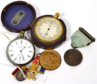 Lot 68 - A pocket compensated barometer; a Continental 935 pocket watch; a South Africa miniature medal; and