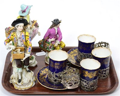 Lot 72 - Three 19th century Continental figures; four Coalport cups and two saucers; and six silver holders
