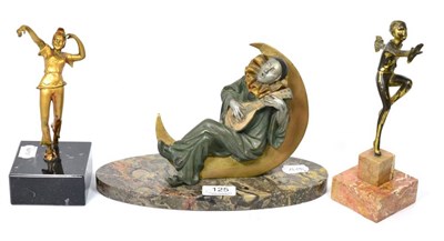 Lot 125 - An Art Deco Spelter figure of a pierrot playing the mandolin sat on the moon, on an oval marble...
