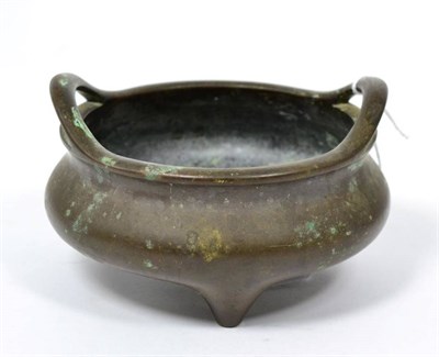 Lot 127 - A Chinese bronze twin handled censer, cast six character mark to base