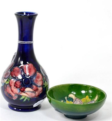 Lot 128 - A Moorcroft bottle vase; and a small bowl (2)