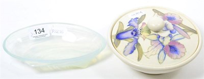 Lot 134 - A Moorcroft Orchid pattern circular powder bowl and cover; and a Sabino glass shell shaped dish (2)