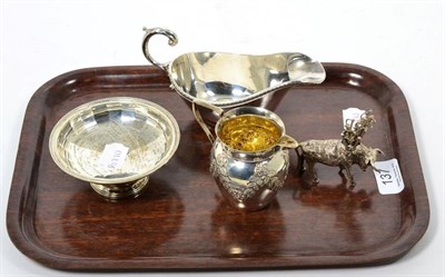 Lot 137 - A silver bon bon dish; an embossed silver jug; a small model of a bull with model knives...