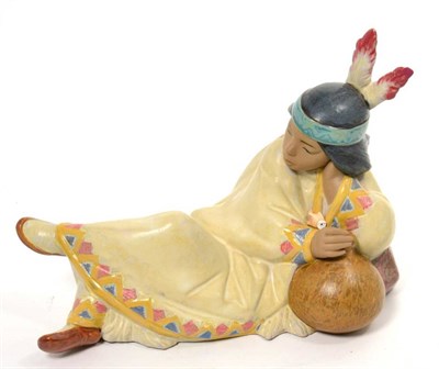 Lot 144 - A Lladro model of a reclining native Indian boy, 'Little Brave Resting', with box