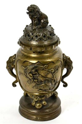 Lot 175 - An Japanese bronze twin handled censer and cover, with elephant mask handles