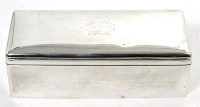 Lot 178 - A large rectangular silver table cigarette box, Chester 1912, the cover engraved with a...