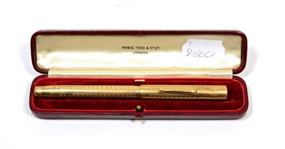 Lot 187 - A Mabie Todd 9 carat gold cased and engine engraved fountain pen with 14 carat gold nib,...