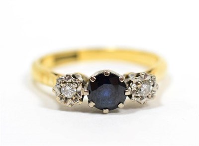 Lot 199 - A sapphire and diamond three stone ring, finger size M, 3.1g, stamped '18CT PLAT'