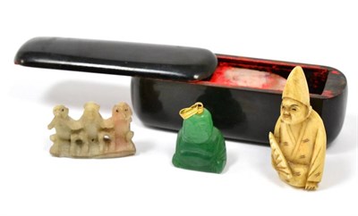 Lot 209 - A Chinese wax seal; an ivory netsuke, circa 1900; a jade type pendant and a small soap stone...