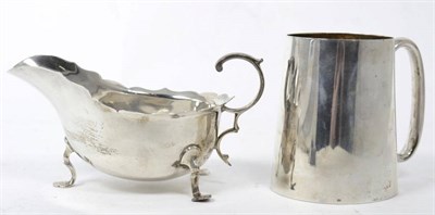 Lot 257 - A silver mug; and a sauceboat