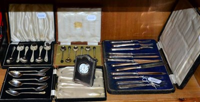 Lot 269 - Three cased sets of silver spoons; silver handled fruit knives and forks; and a silver clock